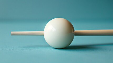 Using the billiard bridge a cue stick prods the white ball