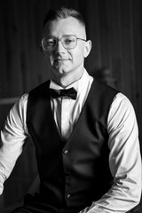 Elegant Black and White Portrait of a Sophisticated Man in Formal Attire