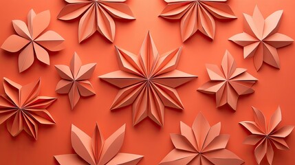 Beautifully crafted paper flowers in various shapes and sizes against a warm orange background, perfect for decoration.