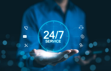 24 hour 7 day customer service and support concept. Businessman presenting virtual icons for 24-7...