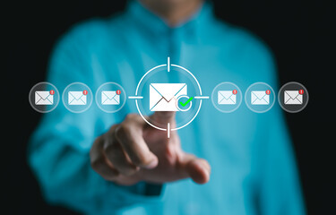 Email marketing and message targeting concept. Businessman interacting with virtual email icons,...