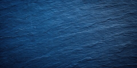 Navy background with dark slate stone texture perfect for backgrounds or textures