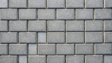 Obraz premium Gray paving tiles creating a modern and minimalist background or texture