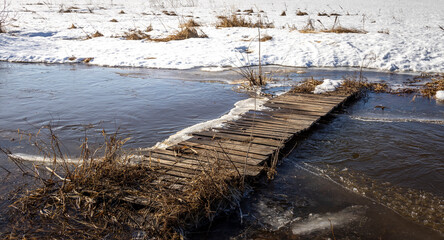 Fototapeta premium A bridge is covered in snow and ice