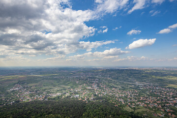 A city view with a blue sky and clouds