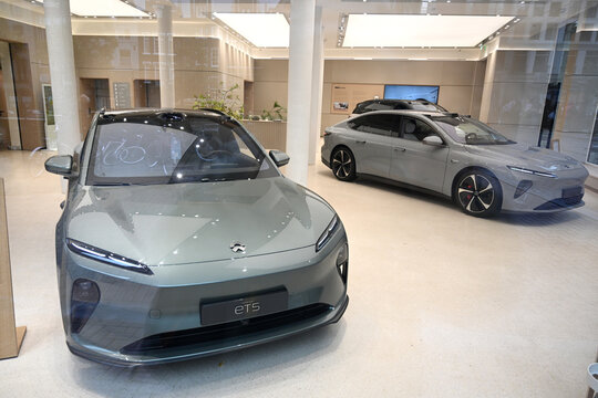 Amsterdam, Netherlands - August 24, 2024: The Nio ET5 and  ET7 electric vehicle in salon in downtown of Amsterdam.
