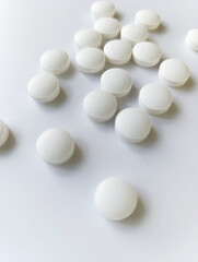 white tablets white coal on a gray background