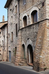 Assisi Street View with Typical Stone Building Facades in Umbria, Italy