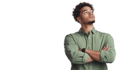 A man with a green shirt and a beard is looking at the camera. He is wearing a green shirt and has his arms crossed