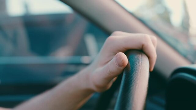 Nervous Driver's Thumb Tapping on Steering Wheel: Close-up of Anxious Hand in Traffic Jam | Stress and Impatience in Car Interior | Emotional Commute Struggle