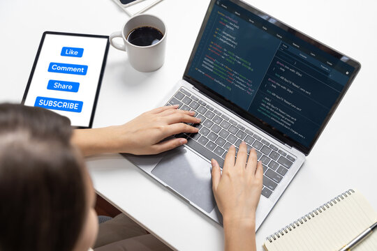 Hand focus of IT developer woman coding on laptop screen, creating social media website system of like, comment, share and subscribe automatic thinking program update data center at office. Postulate.