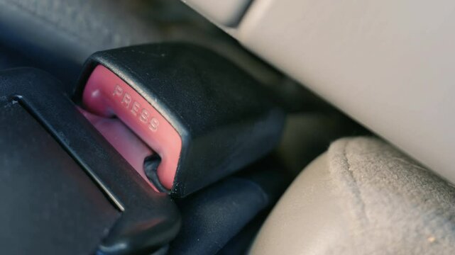 Seatbelt Fastening Close-up: Hand Securing Car Safety Buckle | Vehicle Protection Mechanism in Action | Automobile Safety Compliance | Driver Responsibility Closeup