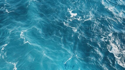 Obraz premium A serene and tranquil scene of the ocean surface, with gentle waves creating a mesmerizing pattern of blue and white.