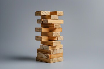 A stack of wooden blocks with one block missing. The blocks are stacked in a pyramid shape, with the top block missing. Concept of instability and imbalance
