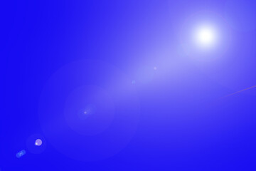 Bright Sunlight Lens Flare on Clear Blue Sky. A stunning lens flare effect with bright sunlight against a vivid blue sky, creating a serene and minimalistic background.