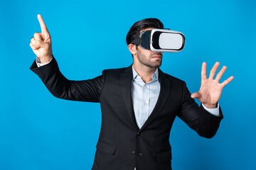 Skilled business man looking at data analysis while wearing VR glasses and suit. Project manager checking and choosing while using visual reality goggles or headset. Innovation technology. Deviation.
