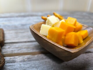 Hard cheese slices on a plate. high quality photos.