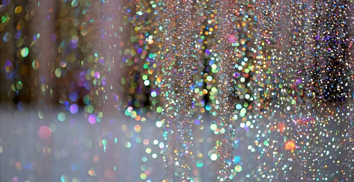 Shiny glitter halographic background, beautiful luxury premium background in motion of shiny diamond particles, copy space 