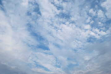 gentle white clouds in the blue sky