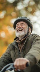 Obraz premium Joyful elderly man biking outdoors during autumn in a peaceful park