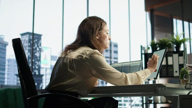 Woman general director managing multiple expansion projects, showcasing her multitasking abilities, organizational and leadership skills. CEO working with commitment to business success. Camera A.