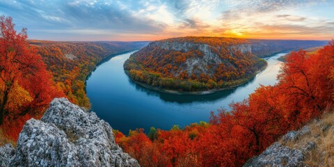 Vibrant autumn landscape along a winding river at sunset