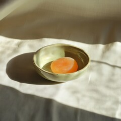 Creamy Fruit Jelly in a Ceramic Dish with Soft Shadows 1