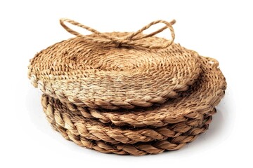 Obraz premium A set of four wicker coasters placed on a clean and simple white background