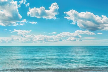 A serene view of the ocean from a sunny beach, perfect for use in travel or tourism projects