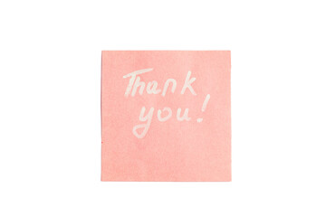 A pink thank you note written with a white marker on a white background