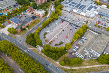 Aerial drone shot of cars parked at an outdoor car park in Harlow Town, England