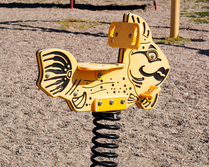 Yellow cartoon style fish park playground spring rocker rider
