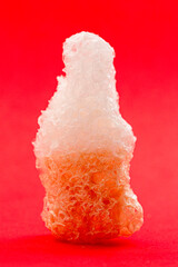 Freeze Dried Cola Buttle Gummies on a Bright Red Background