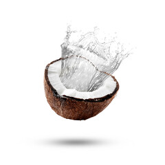 Fresh coconut water splashing from nut in air on white background