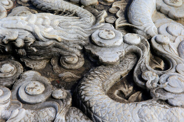 Vintage ornament on the stone. Close-up seamless texture. Stone texture. Embossed pattern.