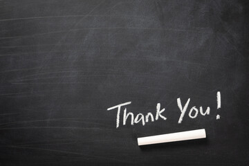 Hand writing Thank You word on blackboard