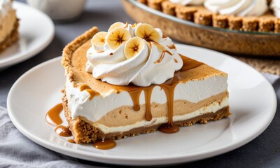 A classic banoffee pie with a graham cracker crust, layers of caramel, banana, and whipped cream