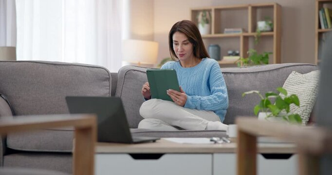 Home, woman and tablet with typing, internet and research with social media in lounge. Person, apartment or girl on couch with technology, digital app or connection with online information or network