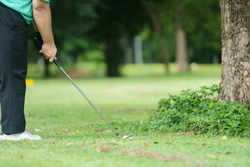 Man is playing golf in morning.