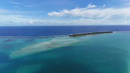 Beautiful curve line of boundary lagoon/ open ocean at Cocos island in Guam