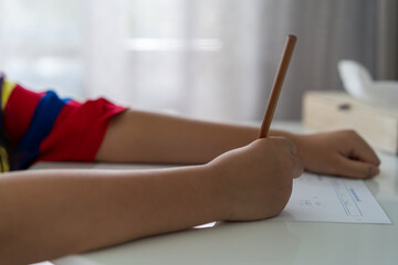 mathematics by closeup hand child or kid student holding pencil to writing calculate multiplication...