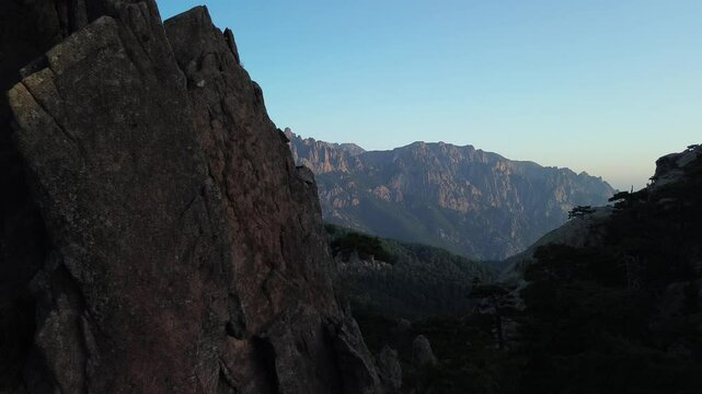 Trou de la Bombe, Massiv dde Bavella, Corse, France at sunrise, view from drone