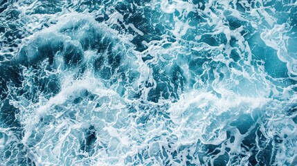 Blue sea water with white foam as abstract background for nature concept.