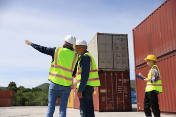 Business professionals are handling container transportation, blue-collar workers are actively engaged in the management of container warehouses, and dock workers are engaged in discussions within the