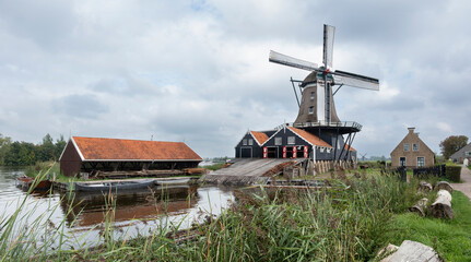 Historic saw mill 'The Rat' with barn and boats in IJlst, Friesland, the Netherlands