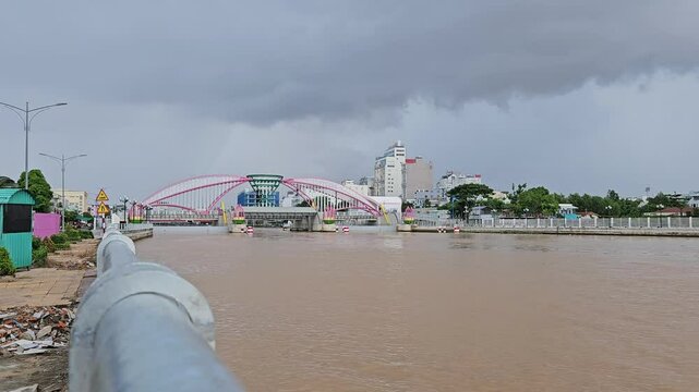 Close up of Can Tho river, Tide Barrier and Cai Khe Boat Lock at Can Tho city, Vietnam in a cloudy day. 