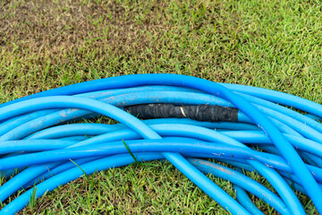 Worker use wrap tape repair leak garden hose