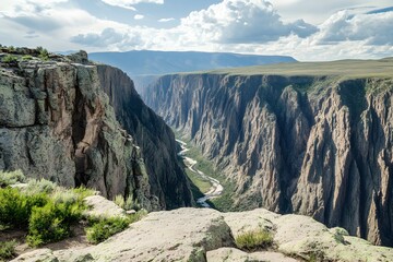 Canyon landscape, with sheer cliffs and a winding river far below