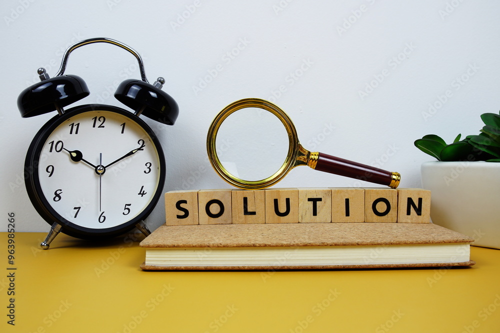 Poster magnifying glass and alarm clock with wooden blocks alphabet letters solution text message on yellow
