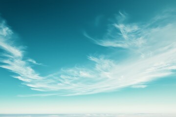 Serene Sky with Wispy Clouds and Tranquil Blue Tones